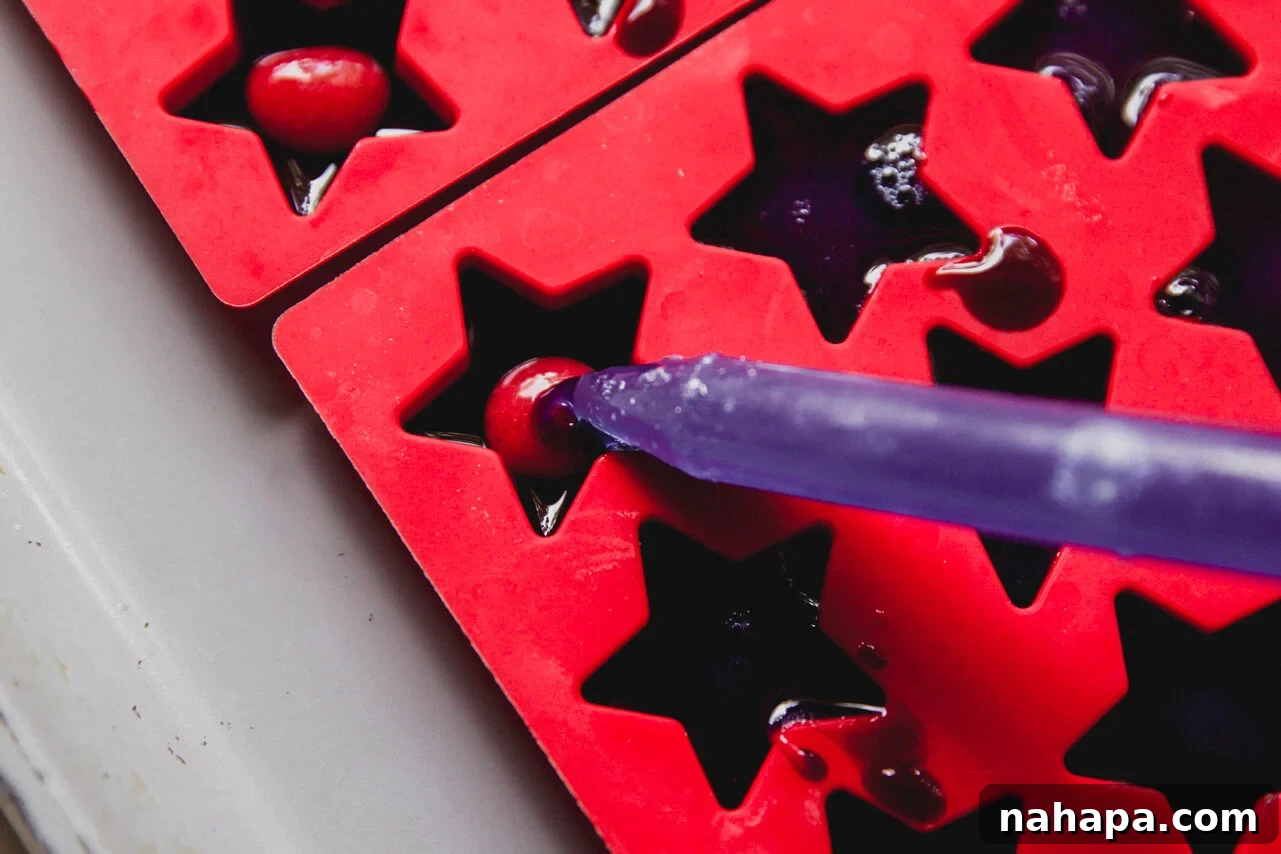A dropper putting a drop into the mold.