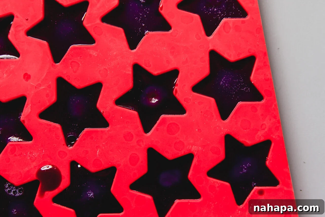 A red mold with the gushers set in it before being removed.