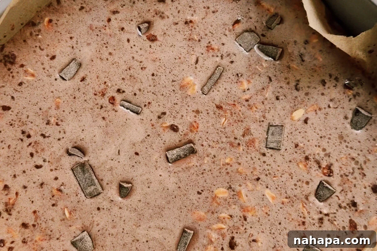 The baked oat mixture in a baking dish before baking.