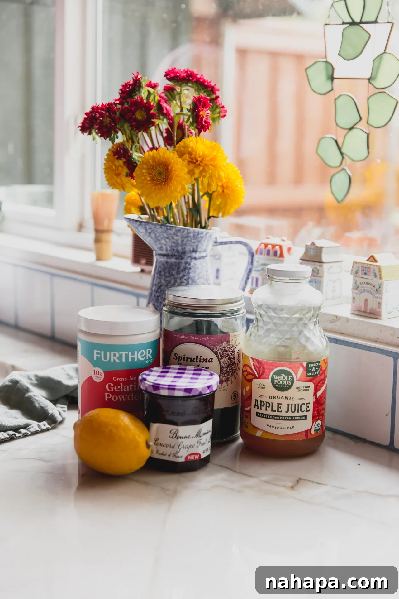 sour apple gusher ingredients on a counter with flowers in the background